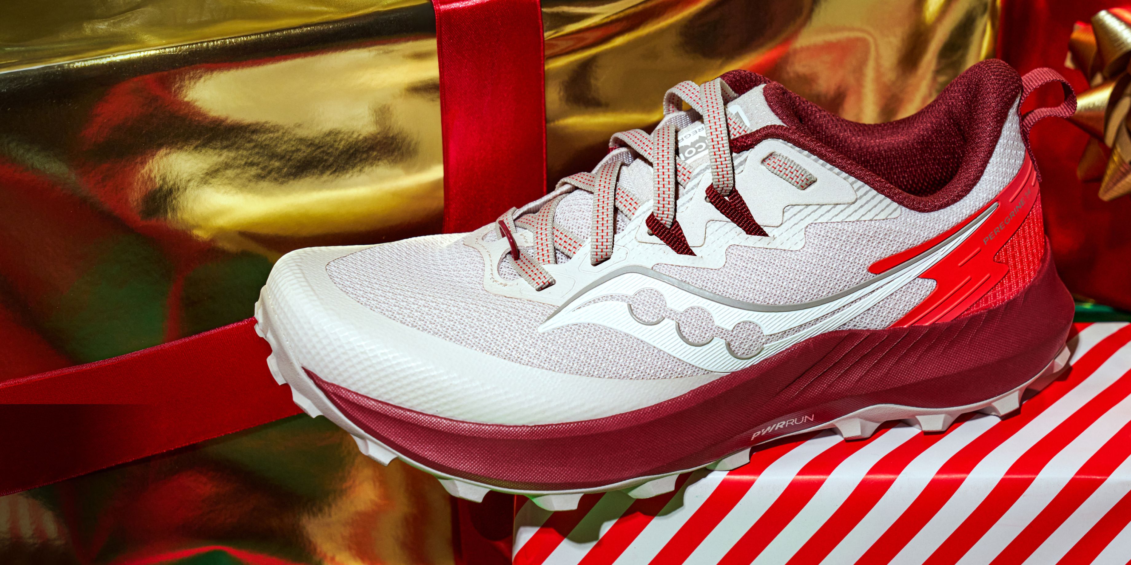 Red & white sneaker on striped wrapping paper.