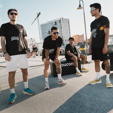 a group of men wearing black shirts and shorts