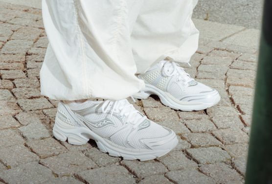 a person wearing white shoes