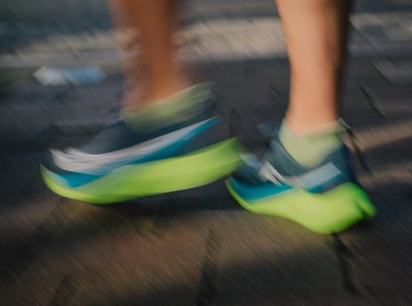 a person's legs in sneakers