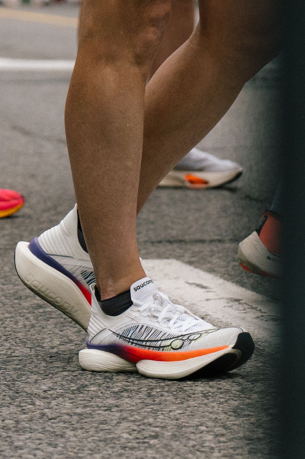 a pair of running shoes on a metal pole