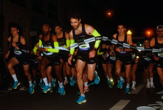 a group of men running in a race