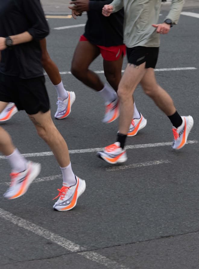 a group of people running on a road