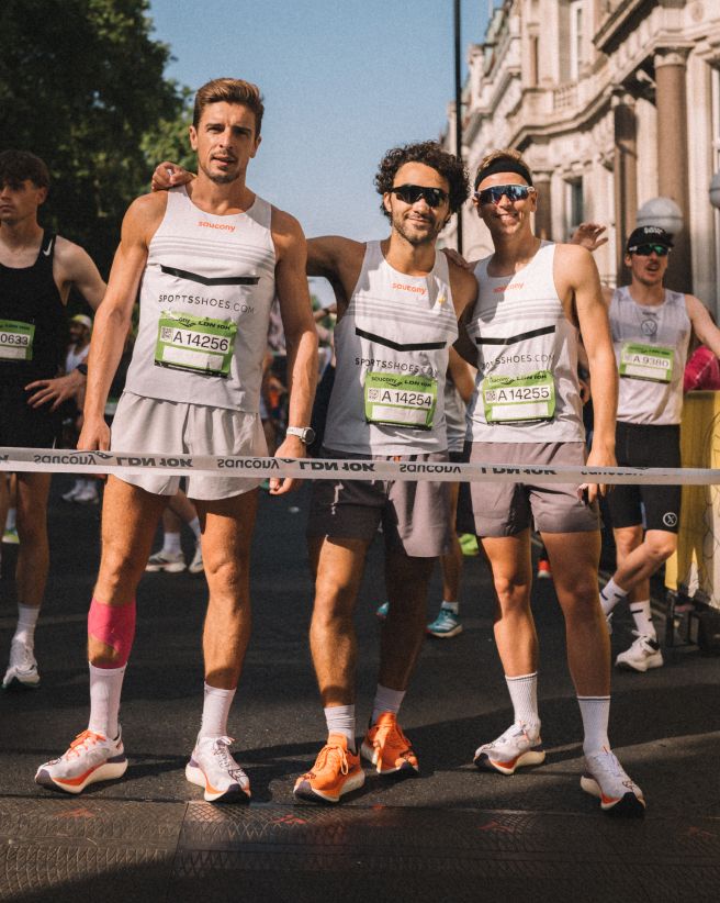 a group of men in running uniforms