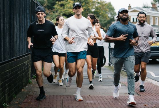 a group of people running on a pavement