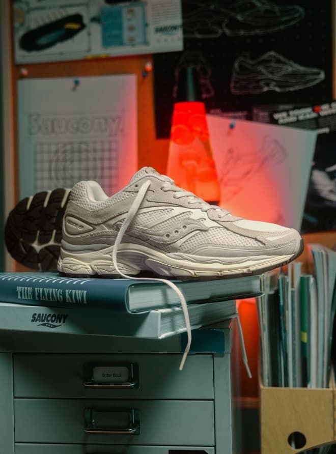 a shoe on top of a stack of books