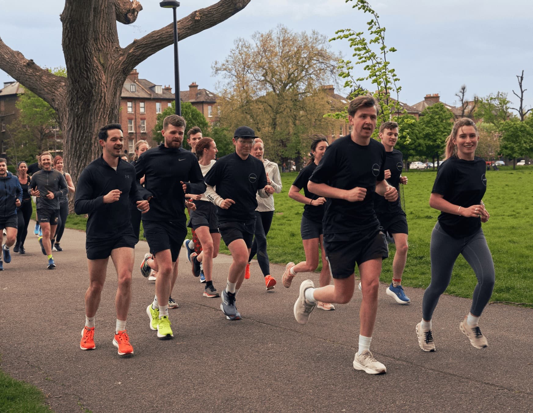 a group of people running on a road