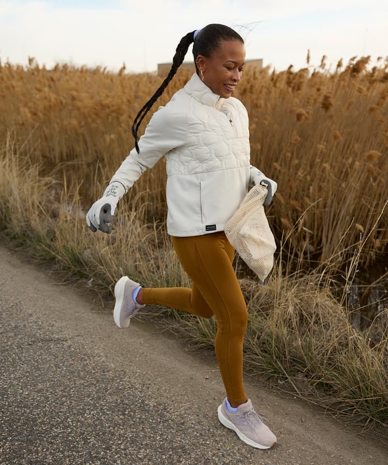 a woman running on a road